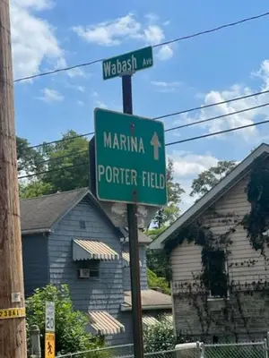 a street sign for marinaopher field in front of a house at Marina house