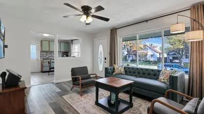 a living room with a couch and a table at Hearth Home Brick Oven Karaoke 4 Bedroom fits 8 in Columbus