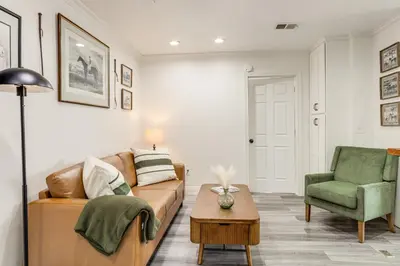 a living room with a couch and a chair at 2 Mi to Ark Encounter! Walkable Williamstown Condo in Williamstown