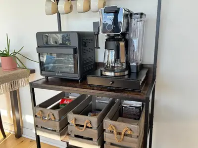 a microwave and a coffee maker on a table at Downtown Condo 5 Minutes to Cedar Point in Sandusky