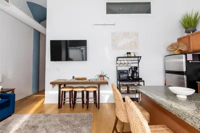 a kitchen with a table and chairs in a room at Downtown Condo 5 Minutes to Cedar Point in Sandusky