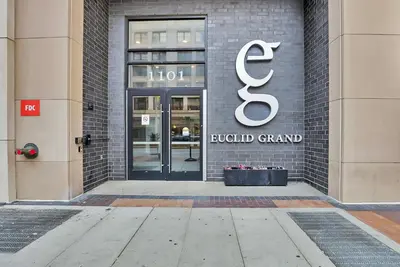 a building with a sign on the front of it at Luxury lofts, Downtown, Playhouse Sq, Near Stadium and Arena, Fire Pit, Rooftop deck, BBQ, Parking -fcfs, Close to EVERYTHIHNG! in Cleveland