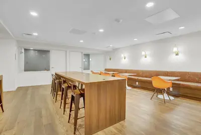 a conference room with a wooden table and chairs at Luxury lofts, Downtown, Playhouse Sq, Near Stadium and Arena, Fire Pit, Rooftop deck, BBQ, Parking -fcfs, Close to EVERYTHIHNG! in Cleveland