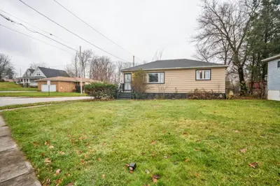 a yard with a house and a house at Blue Bayou Cozy in South Cleveland in Cleveland