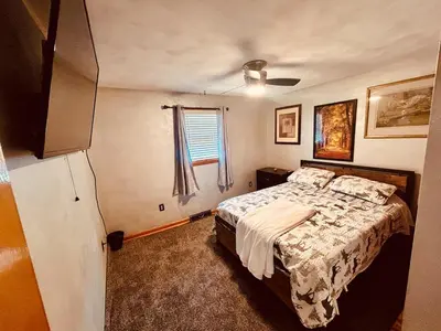 a bedroom with a bed and a window at Del La Rose in Clarksburg
