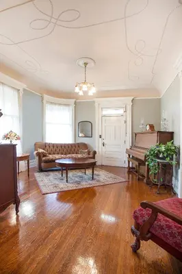 a living room with a couch and a table at Market Street Inn in Wooster