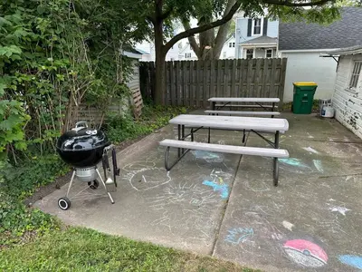 a grill and a picnic table with a grill and a grill at Totally renovated large family getaway! King bed