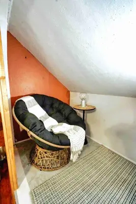 a dog bed sitting in the corner of a room at Nell's Place in Cincinnati