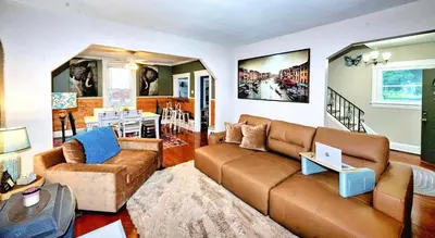 a living room with a couch and a table at Nell's Place in Cincinnati