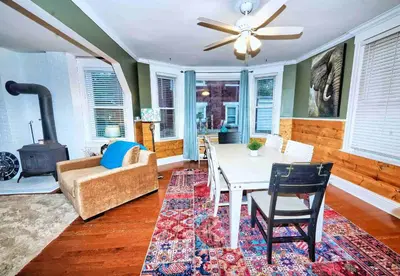 a living room with a table and a couch at Nell's Place in Cincinnati