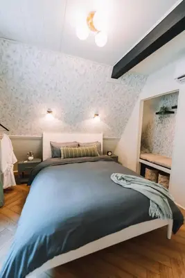 a bedroom with a large bed in a room at Secluded A-Frame Hocking Hills Hot Tub Fire Pit in South Bloomingville