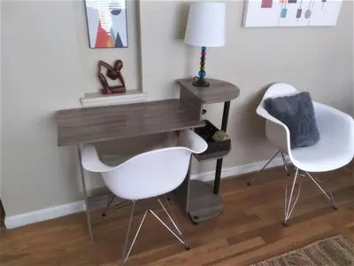 a desk with two white chairs and a table with a lamp at Affordable for 8 guests-King bed-2 Baths-Firepit in Brooklyn