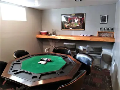 a poker room with a table and chairs at Affordable for 8 guests-King bed-2 Baths-Firepit in Brooklyn
