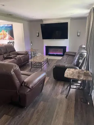 a living room with couches and a fire place at [4-BR/Sleeps 12] Family & Friends Home in Indiana in New Haven