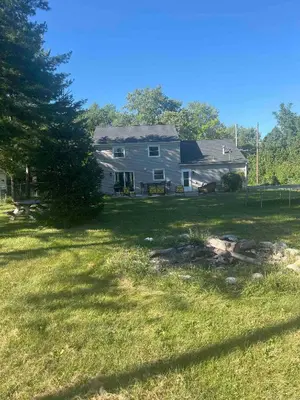 a house with a yard with a grass field at [4-BR/Sleeps 12] Family & Friends Home in Indiana in New Haven