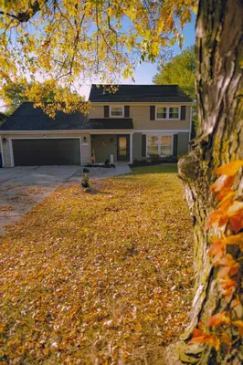 a house with a yard with leaves on the ground at [4-BR/Sleeps 12] Family & Friends Home in Indiana in New Haven