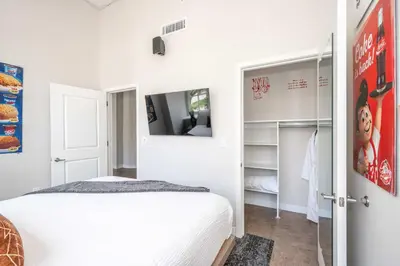 a bedroom with a bed and a tv in it at The 333 Suites 203 - Stay for 6 in Cincinnati