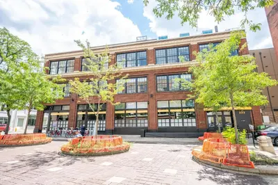 a large brick building with trees in front of it at The 333 Suites 301 - Suite for 6 in Cincinnati