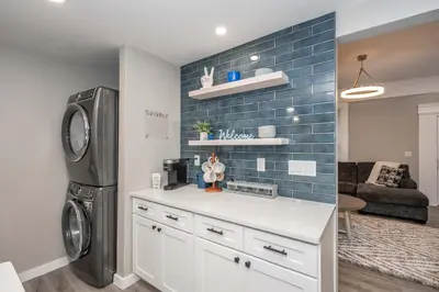 a kitchen with a washer and dryer in a room at The Gathering House - Home for 6 in Harrison
