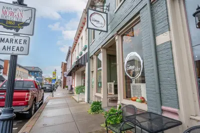 a street with a store on the side of a building at The Gathering House - Home for 6 in Harrison