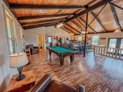 a living room with a pool table in it at The Lodge at Hocking Hills - 2 Hot Tubs - 6 acres - Lake access in Rockbridge