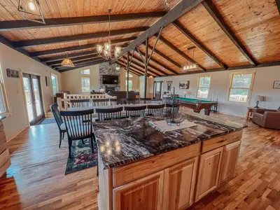 a living room with a bar and a pool table at The Lodge at Hocking Hills - 2 Hot Tubs - 6 acres - Lake access in Rockbridge