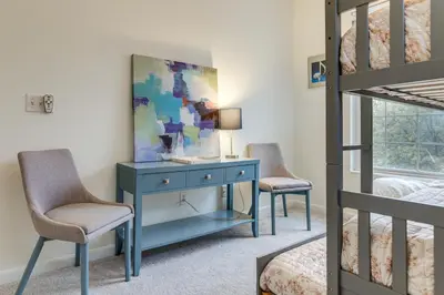 a bedroom with a blue desk and two chairs at 1 Mi to Dtwn Cincinnati Spacious Townhome with Deck in Cincinnati