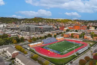 an aerial view of a football field in a city at 1 Mi to Dtwn Cincinnati Spacious Townhome with Deck in Cincinnati