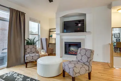 a living room with a fireplace and a tv at 1 Mi to Dtwn Cincinnati Spacious Townhome with Deck in Cincinnati
