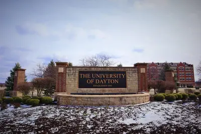 a sign in front of a university of dayton at Spacious 4BR Home Near UD Oregon and DT Dayton in Dayton