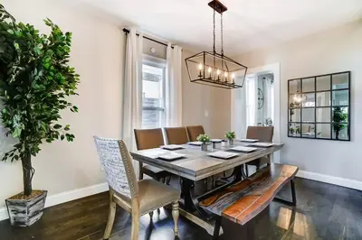 a dining room with a table and chairs at Spacious 4BR Home Near UD Oregon and DT Dayton in Dayton