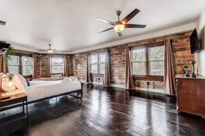 a bedroom with a bed and a ceiling fan at Dayton Loft close to DT Oregon UD in Dayton