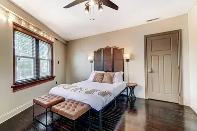 a bedroom with a large bed and a ceiling fan at Dayton Loft close to DT Oregon UD in Dayton