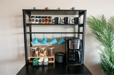 a shelf with a coffee maker and a coffeemaker at Downtown Sleeps 8 By Cedar Point & Sports Force! in Sandusky