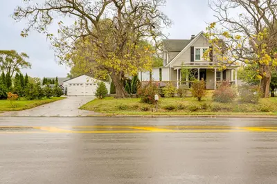 a house on the side of the road at 2 Mi to Dtwn Charming Sandusky Getaway with Hot Tub in Sandusky