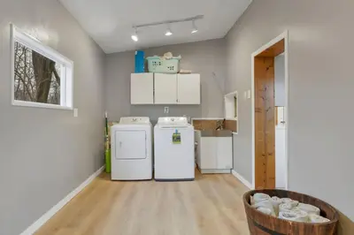 a kitchen with two refrigerators in a room at Canary Cottage in Thornville