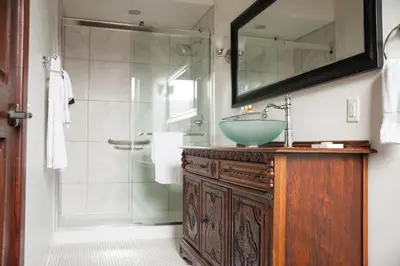 a bathroom with a sink and a shower at The Hackett Hotel in Marietta