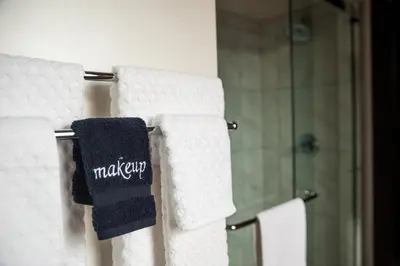 a towel hanging on a towel rack in a bathroom at The Hackett Hotel in Marietta