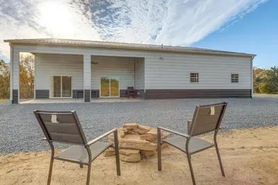 two chairs sitting in front of a building at Patio and Views Country Getaway in Bluegrass Region in Carlisle