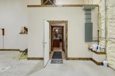 a hallway leading into a room with a white wall at Patio and Views Country Getaway in Bluegrass Region in Carlisle