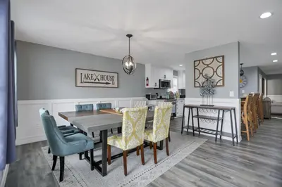 a kitchen and dining room with a table and chairs at Colonial on Crane in Buckeye Lake