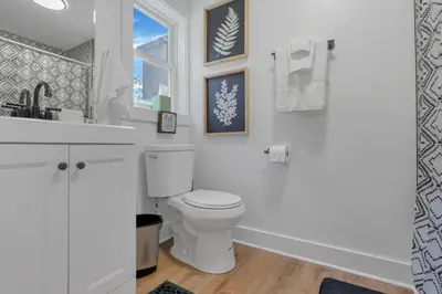 a bathroom with a white toilet and a sink at Adventures at Aspen Way in Rockbridge