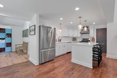 a large kitchen with a stainless steel refrigerator at Adventures at Aspen Way in Rockbridge