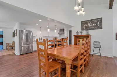 a kitchen and dining room with a wooden table and chairs at Adventures at Aspen Way in Rockbridge
