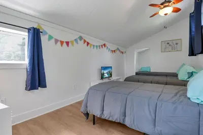 a bedroom with a bed and a ceiling fan at Adventures at Aspen Way in Rockbridge