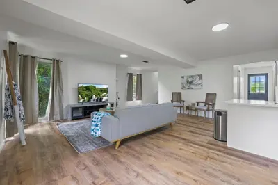 a living room with a couch and a table at Luxury on Lakeside
