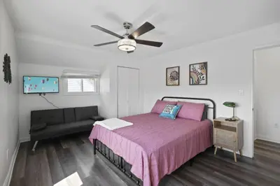 a bedroom with a bed and a ceiling fan at Good Vibes Only in Thornville