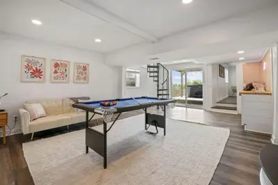 a living room with a ping pong table in it at Good Vibes Only in Thornville
