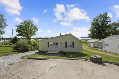 a small green house in the middle of a driveway at Good Vibes Only in Thornville