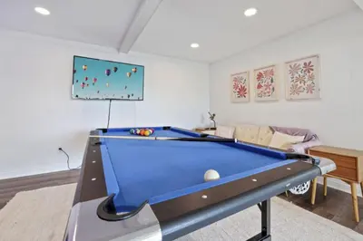 a living room with a pool table in it at Good Vibes Only in Thornville
